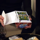 Hands hold a box of G.I. Joe cards that celebrity Logan Paul bought for way too much money.